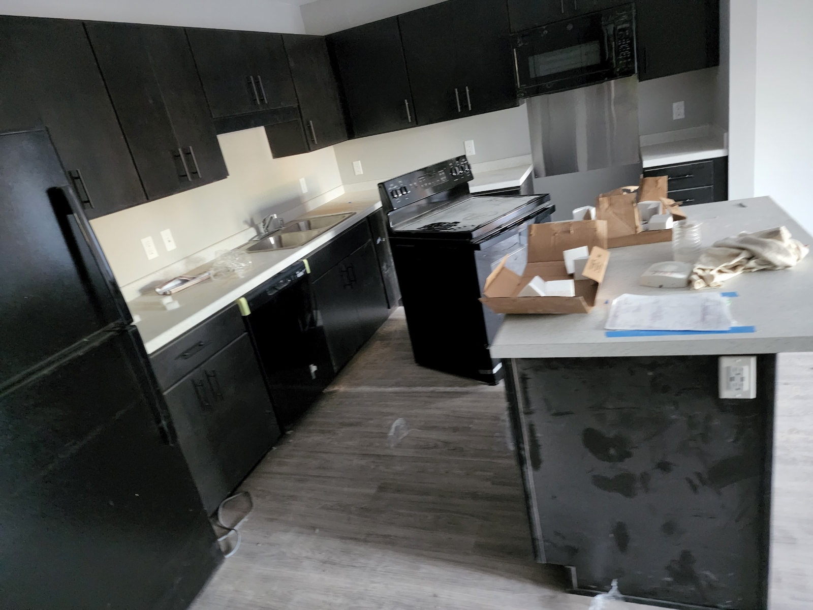 Kitchens prior to post-construction clean up. Pristine Cleaning Services in Minneapolis.